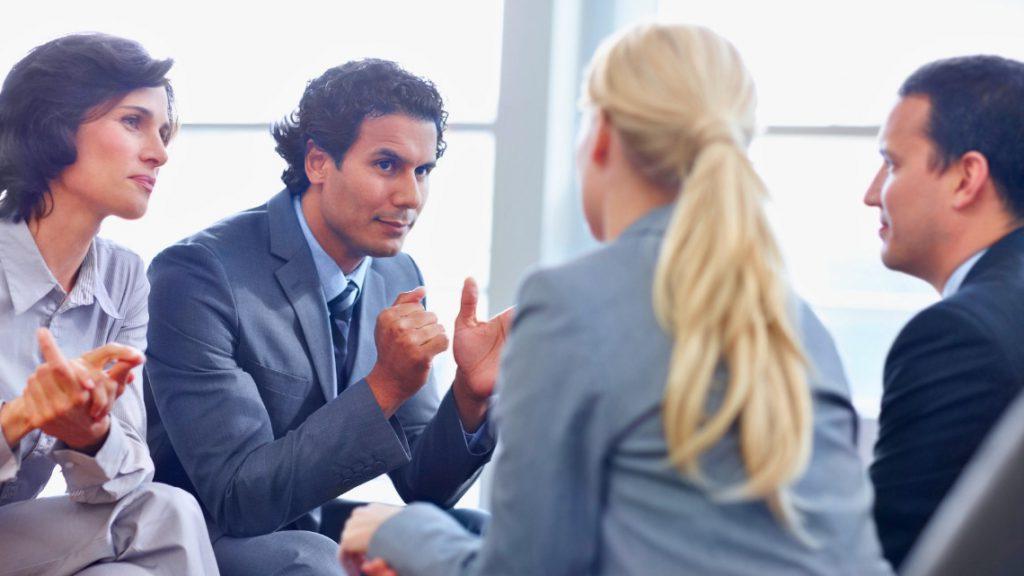 Group of coworkers exhibiting political differences